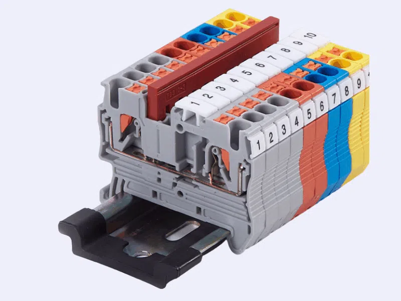 push-in terminal block with spring clamp mechanism securing the wire