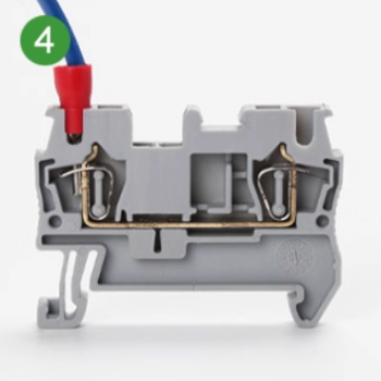 Press orange button to release wire from ST push-in terminal block
